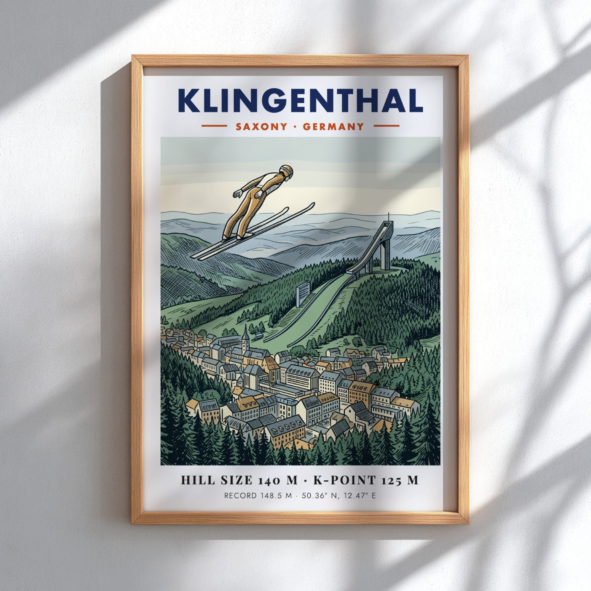 Poster of a ski jumper in flight over the Klingenthal town and hill.