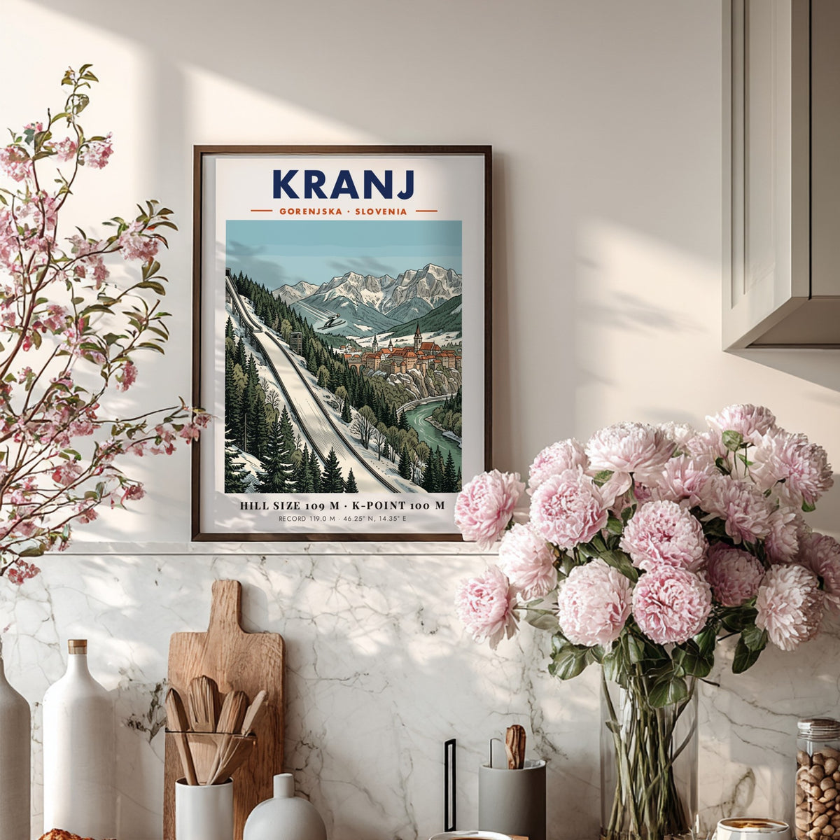 Poster of Kranj Slovenia featuring a ski jumper above a historic town and mountains.