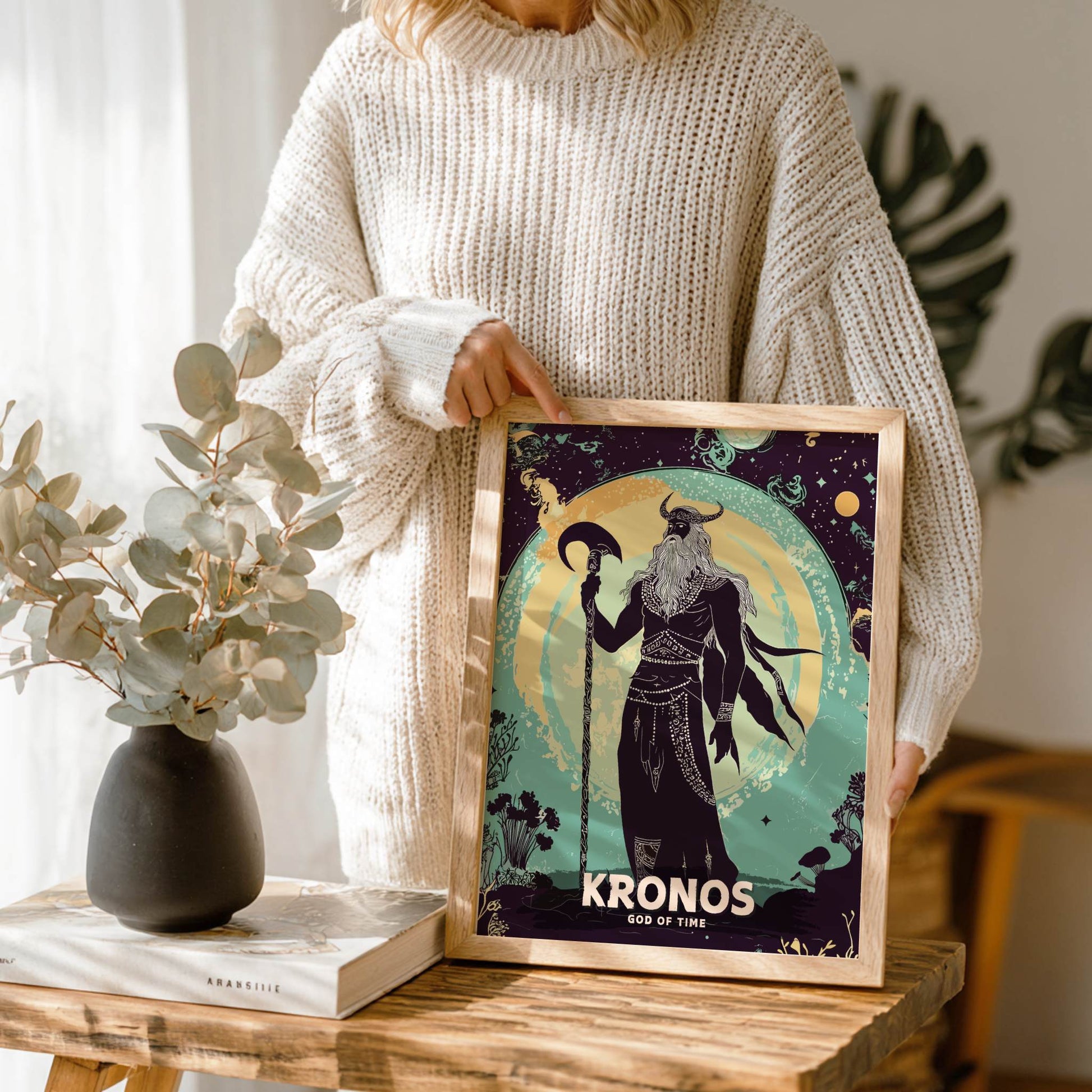 Person holding a framed print of 'Kronos, God of Time' in a home setting.