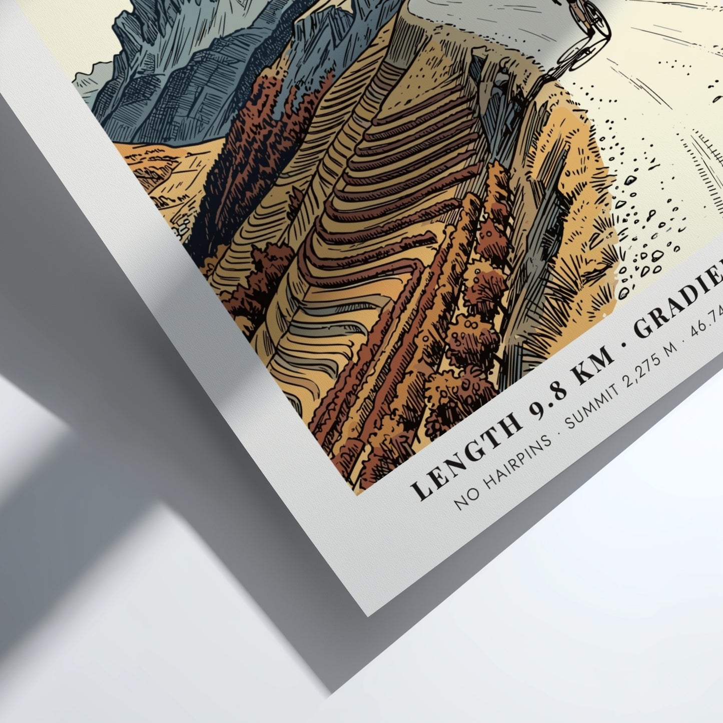 Poster of a cyclist climbing the gravel road to the Kronplatz summit peak.