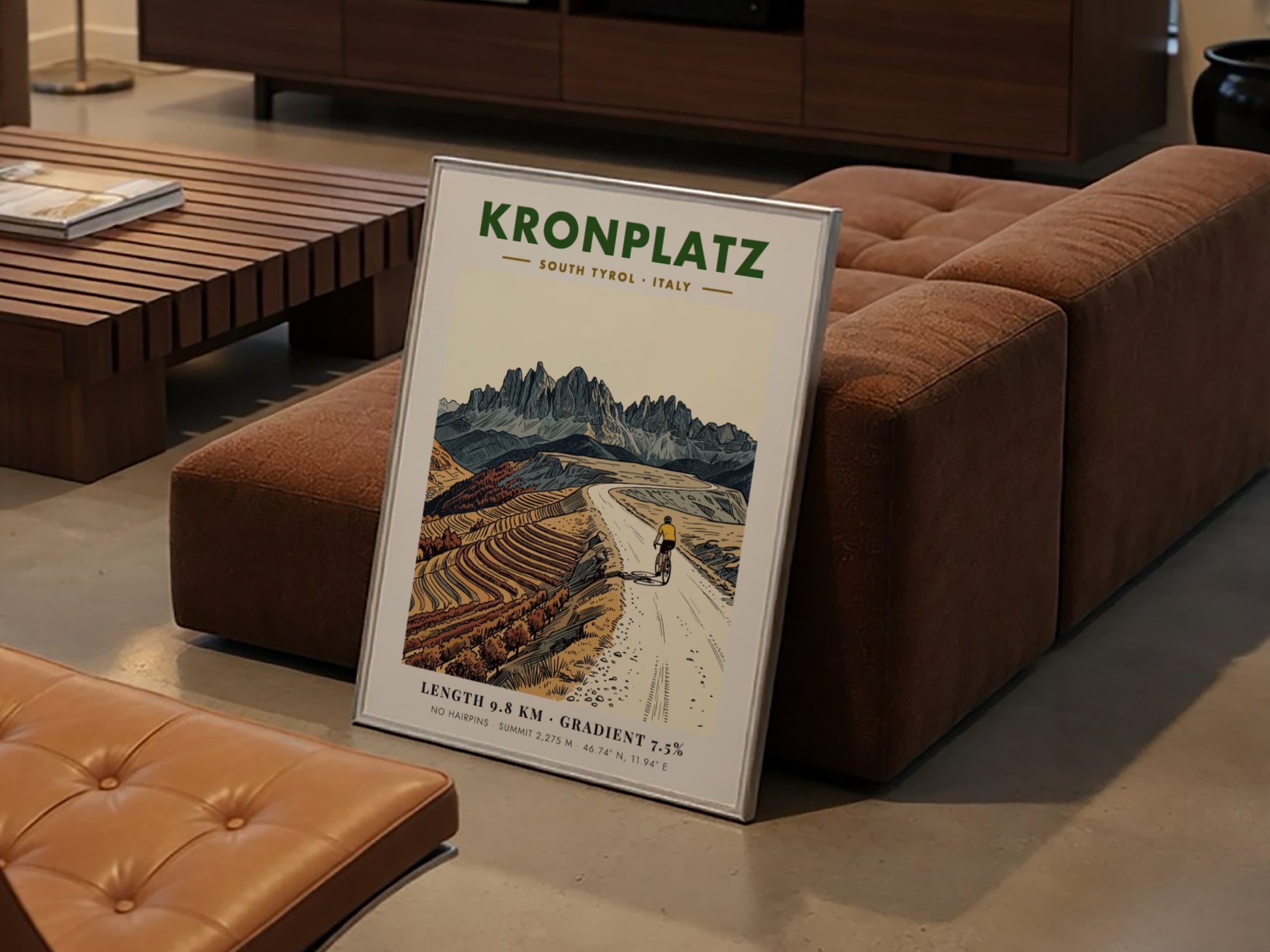 Poster of a cyclist climbing the gravel road to the Kronplatz summit peak.