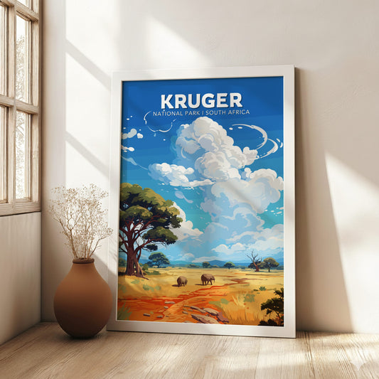 Framed Kruger National Park poster in a room with a vase on a wooden floor.