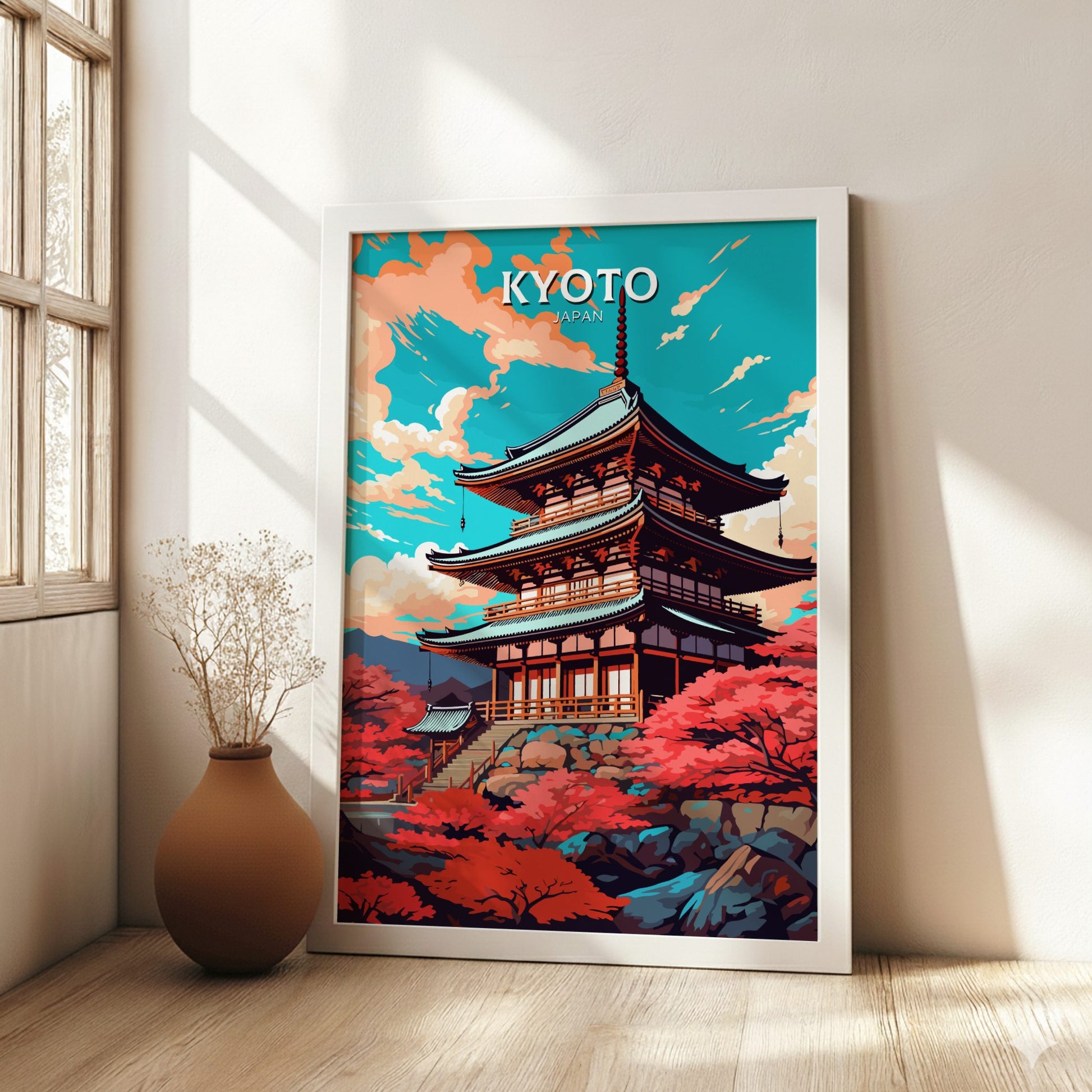 Framed artwork of a Japanese temple with 'Kyoto' text in a room with a vase and plant.