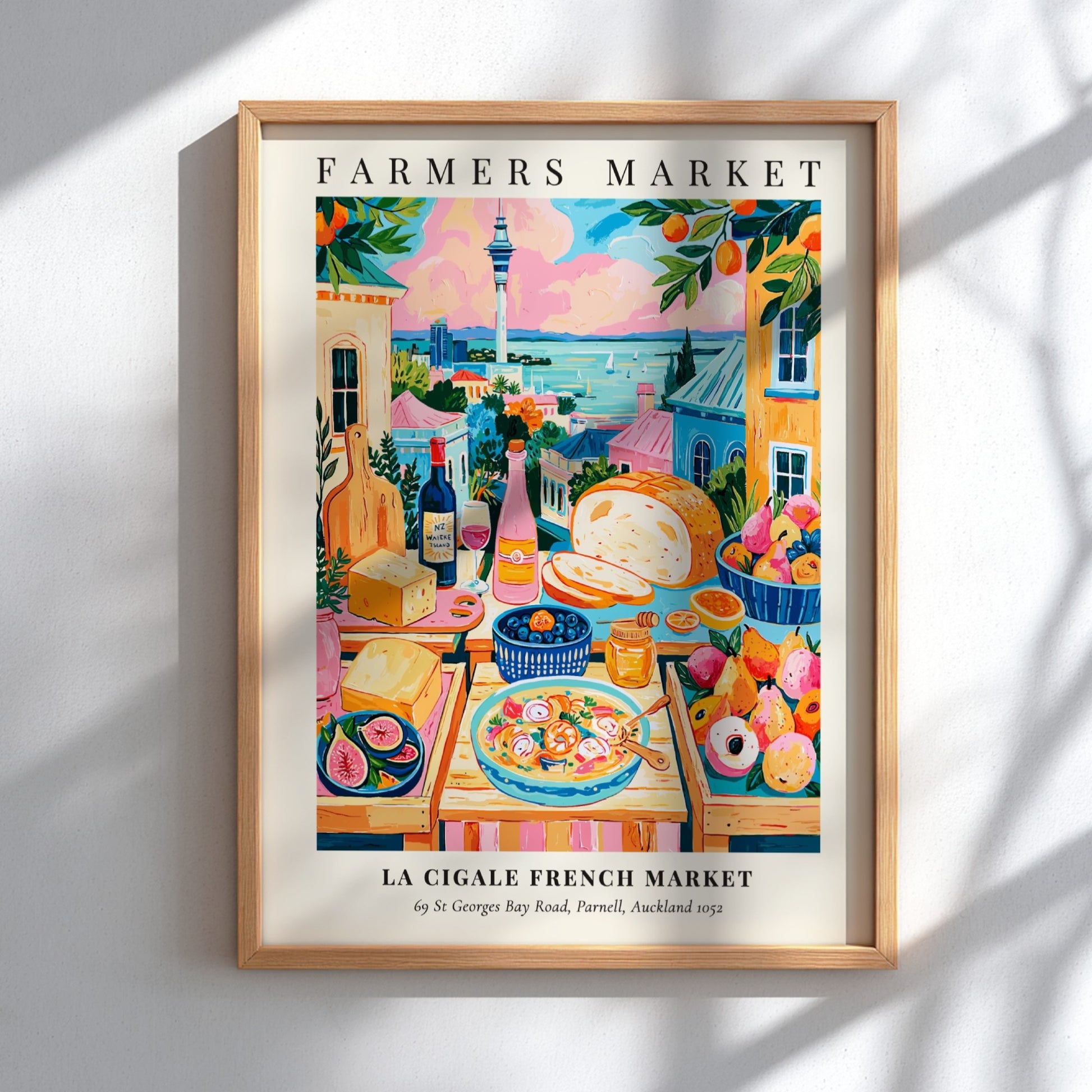 Farmers market poster featuring colorful produce and scenic view of La Cigale French Market in Auckland