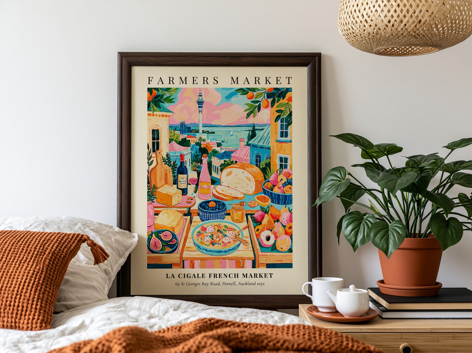Farmers market poster featuring colorful produce and scenic view of La Cigale French Market in Auckland