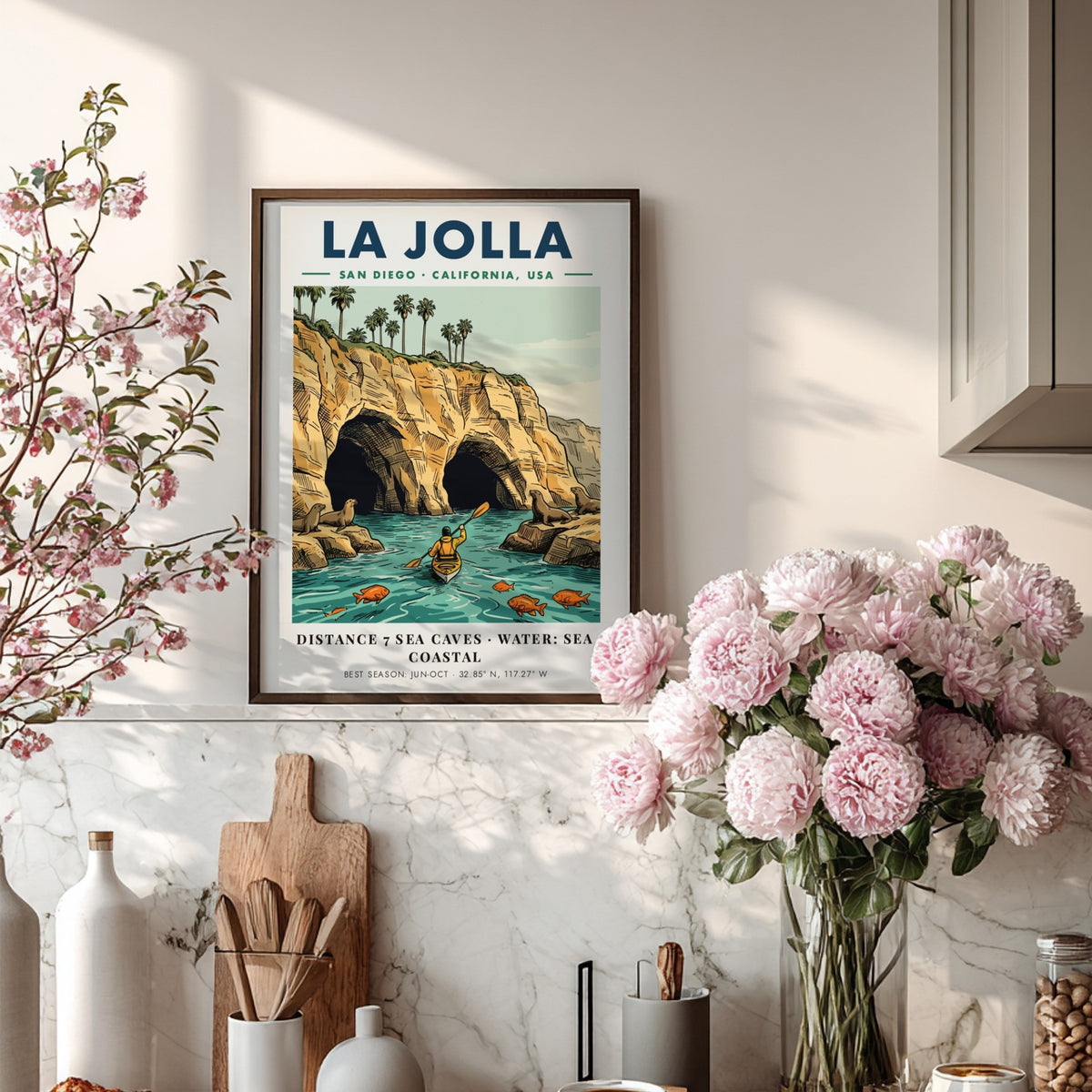 Poster of La Jolla coastline featuring sea caves, a kayaker, and sea lions.