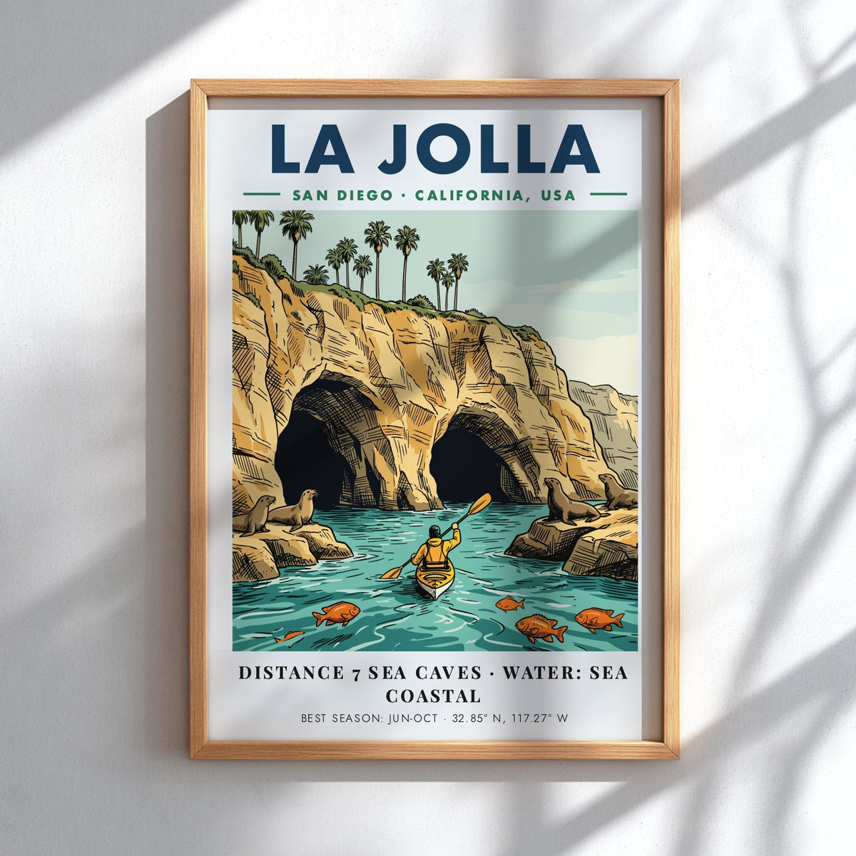 Poster of La Jolla coastline featuring sea caves, a kayaker, and sea lions.