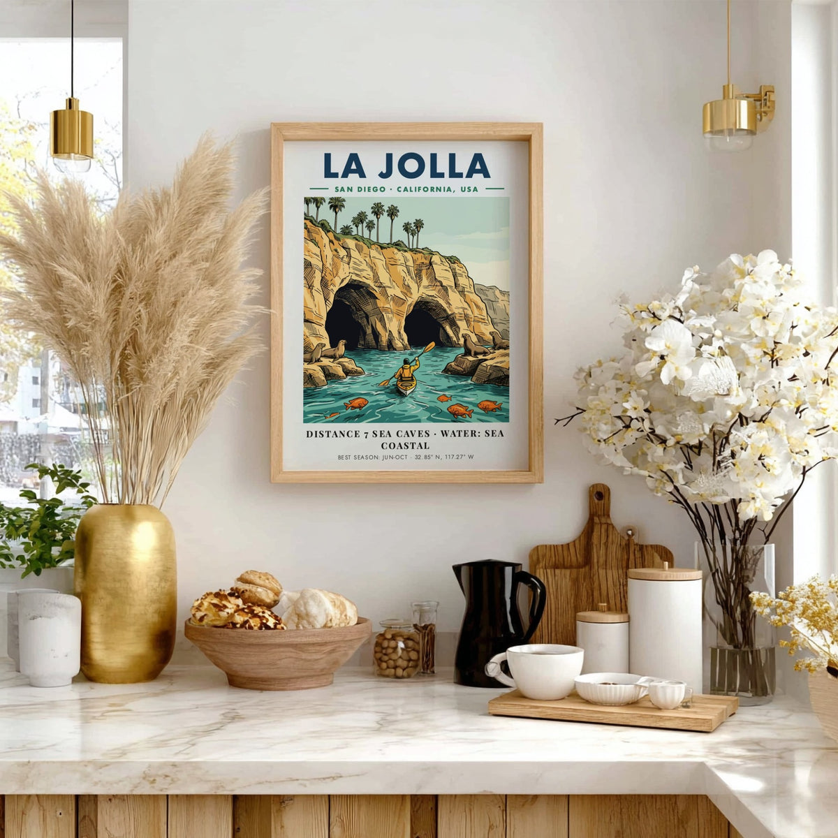 Poster of La Jolla coastline featuring sea caves, a kayaker, and sea lions.