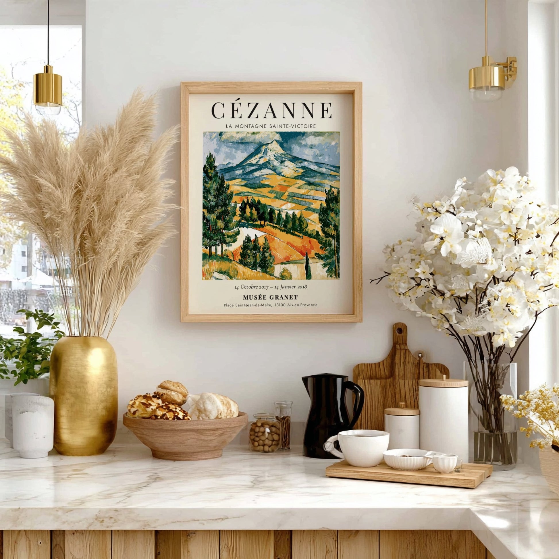 Cézanne exhibition poster featuring La Montagne Sainte-Victoire with vibrant colors and expressive