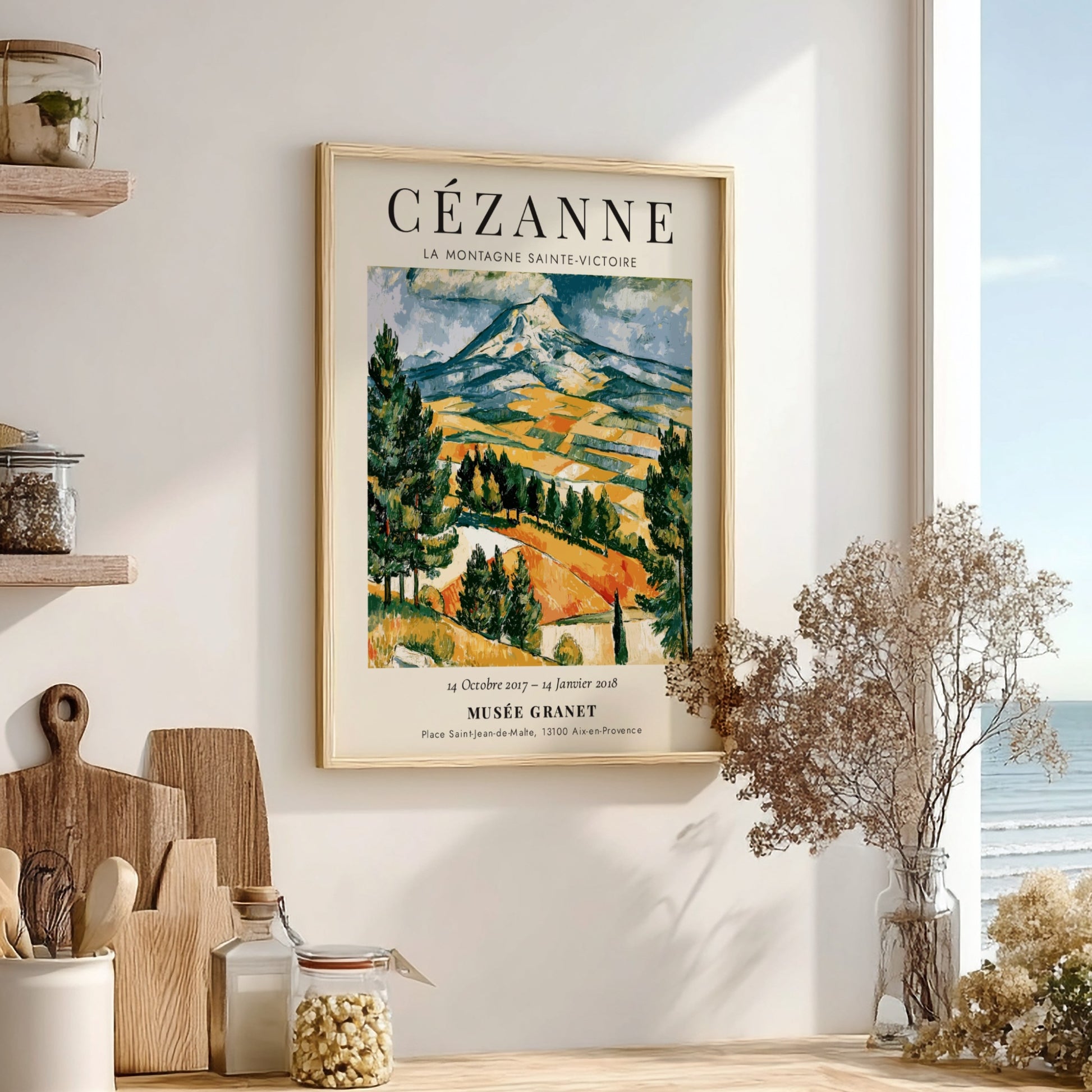 Cézanne exhibition poster featuring La Montagne Sainte-Victoire with vibrant colors and expressive