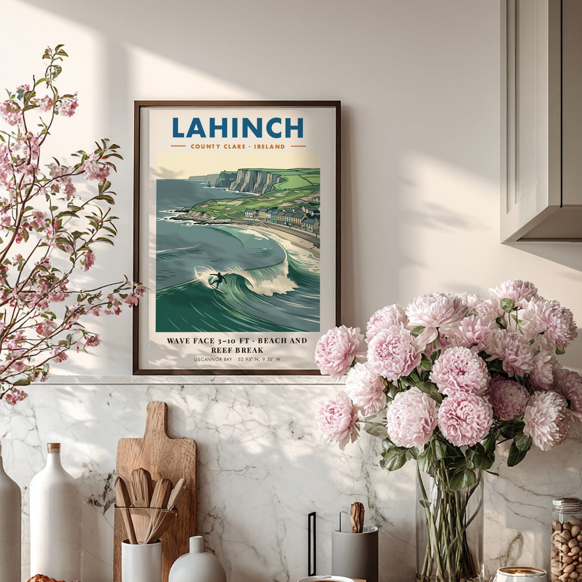 Poster of Lahinch with a surfer on a wave near cliffs and houses.