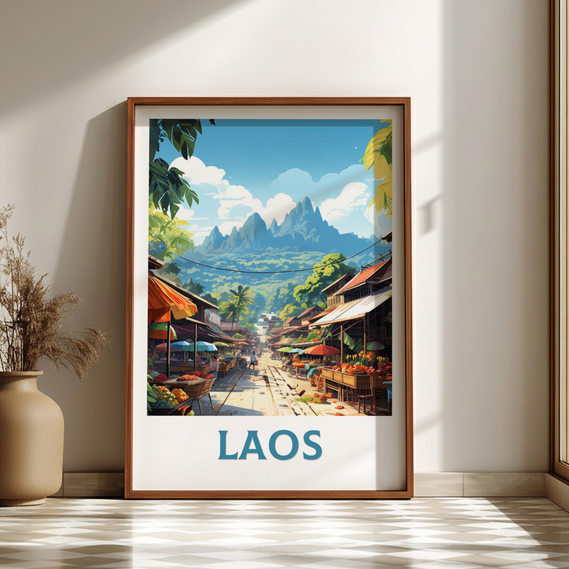Framed artwork of a street scene in Laos with mountains in the background