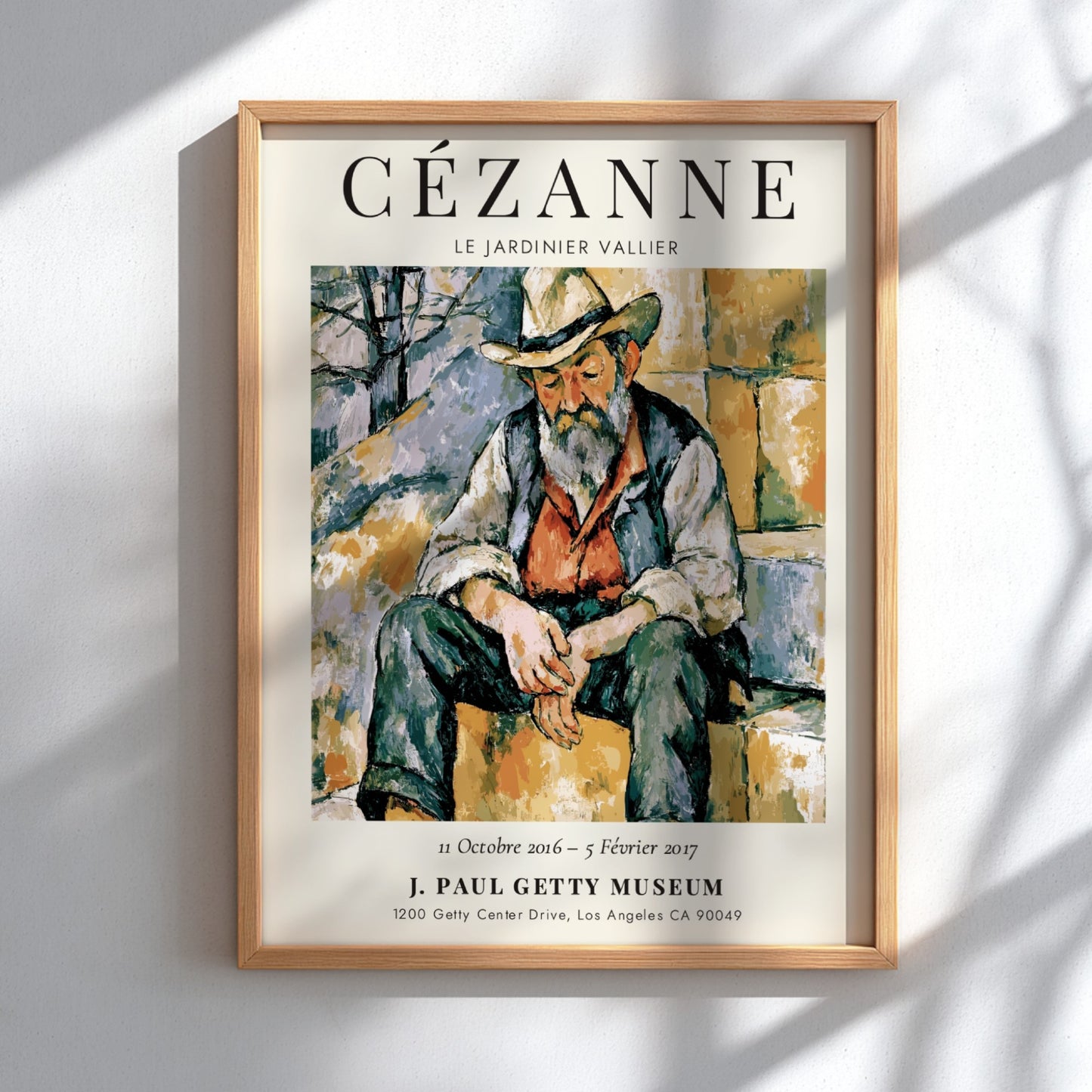 Cézanne exhibition poster featuring Le Jardinier Vallier in warm tones and expressive brushwork