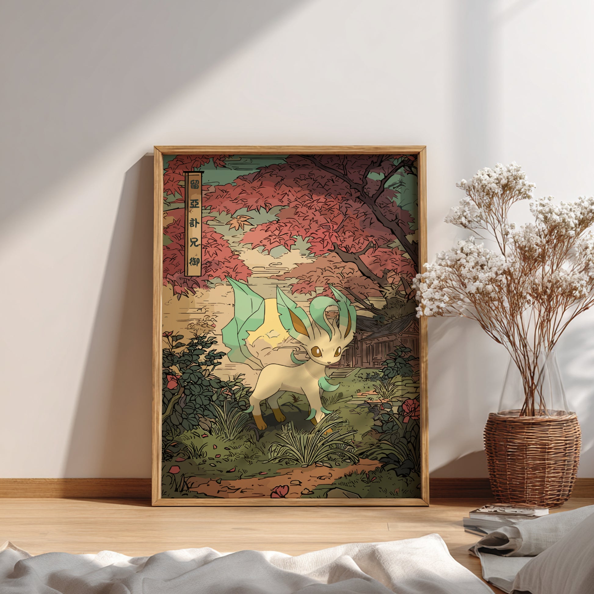 Framed artwork of Leafeon Pokemon in a forest setting on a wall with a vase of flowers.