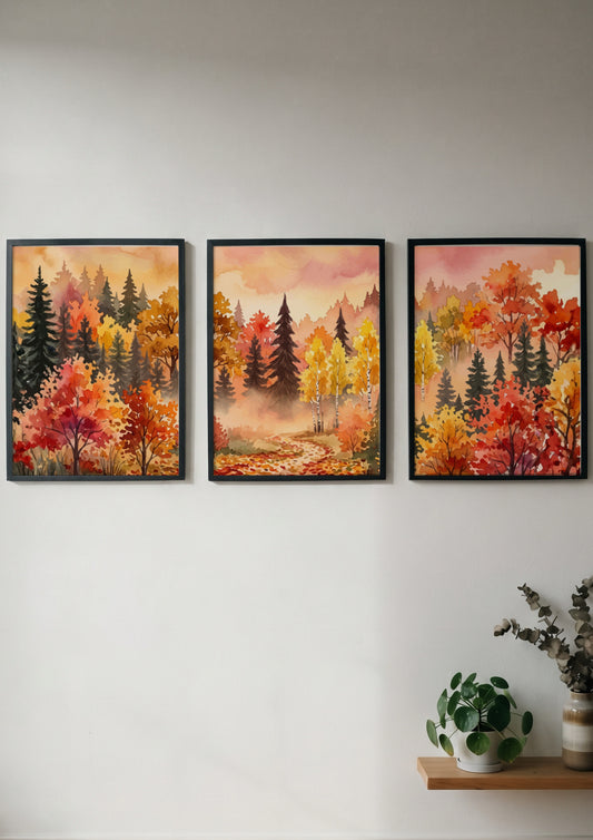 Three framed watercolor paintings of an autumn forest with orange and yellow trees