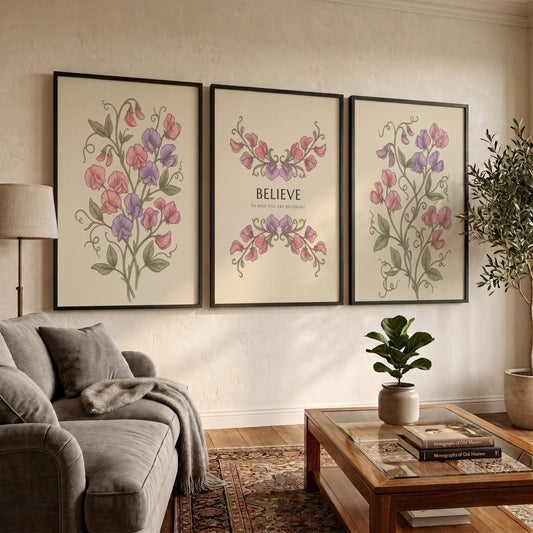 Poster triptych featuring sweet pea flowers and the word believe on a cream background.