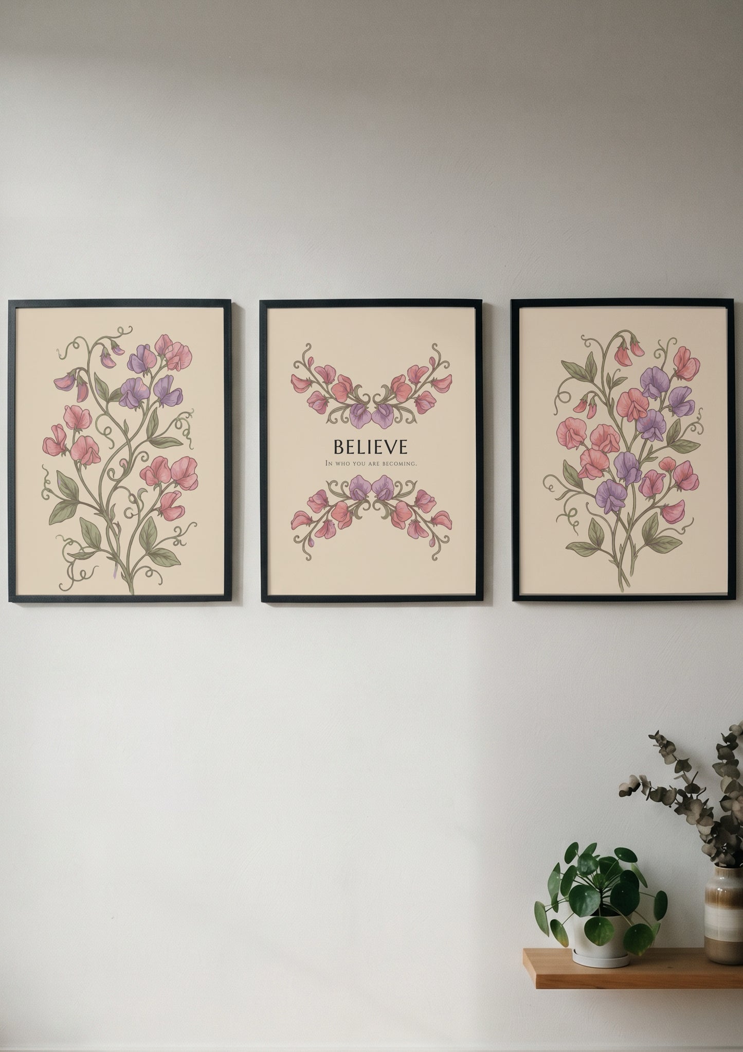 Poster triptych featuring sweet pea flowers and the word believe on a cream background.