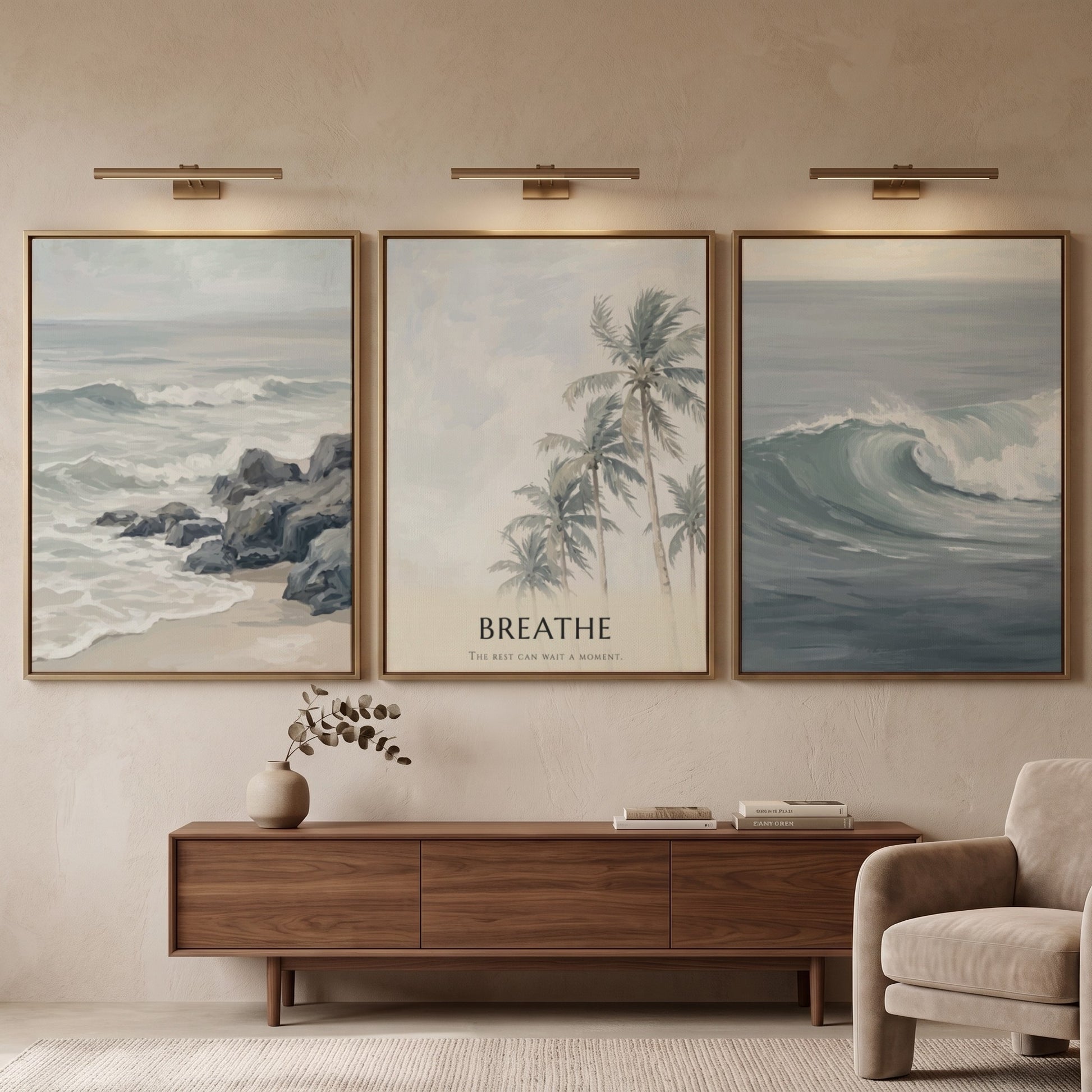 Poster triptych of ocean waves and palm trees with Breathe text on wall