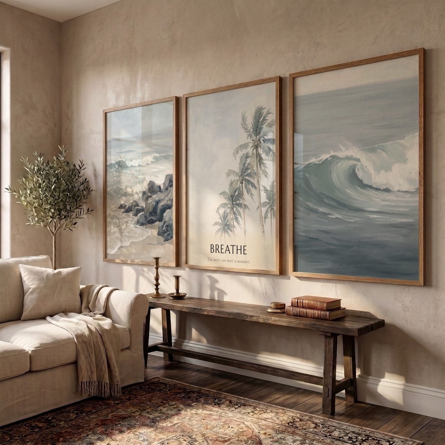 Poster triptych of ocean waves and palm trees with Breathe text on wall