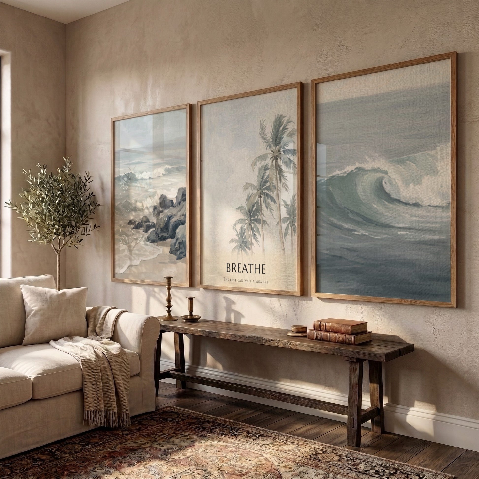 Poster triptych of ocean waves and palm trees with Breathe text on wall