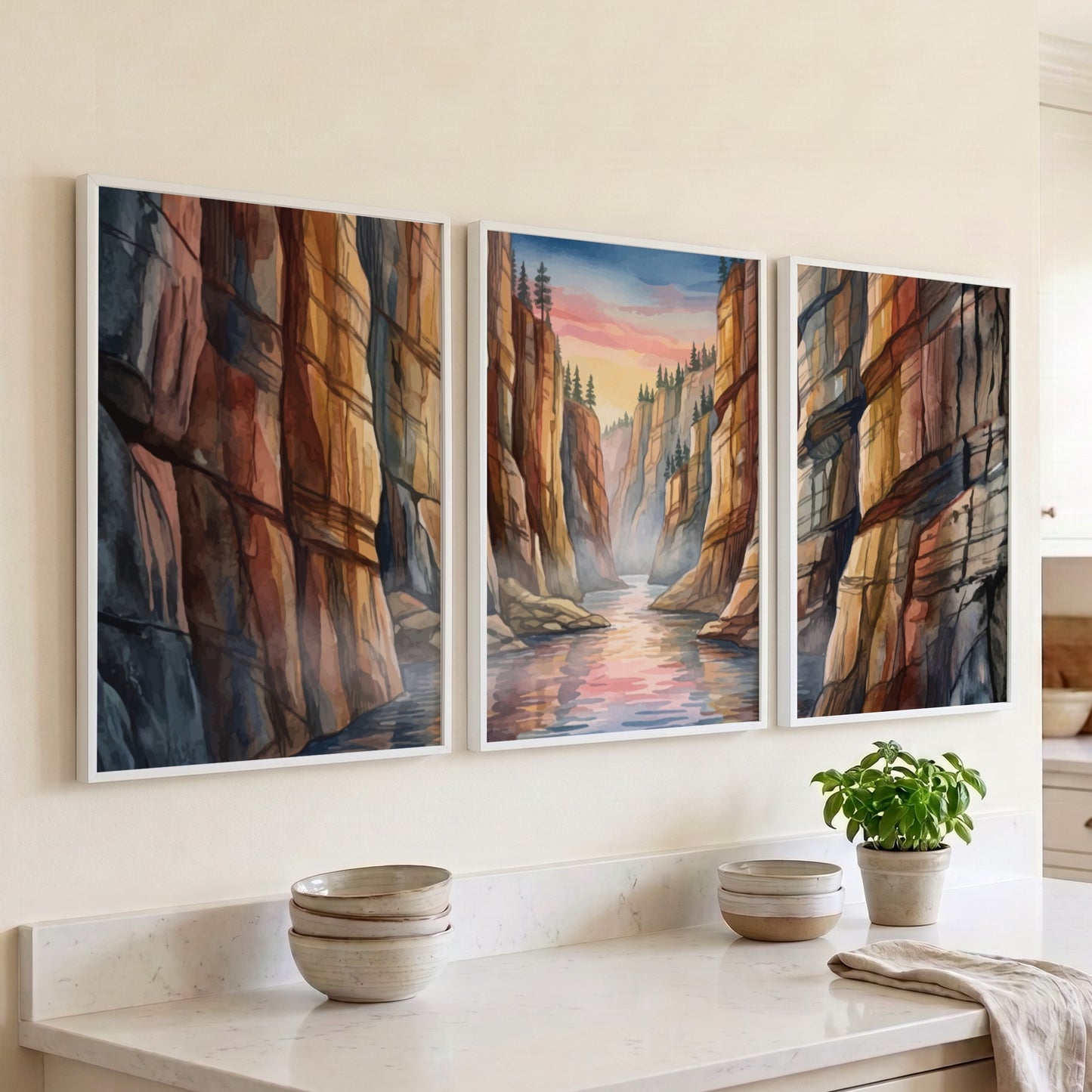 Three vertical watercolour panels depicting a canyon river landscape under a sunset sky