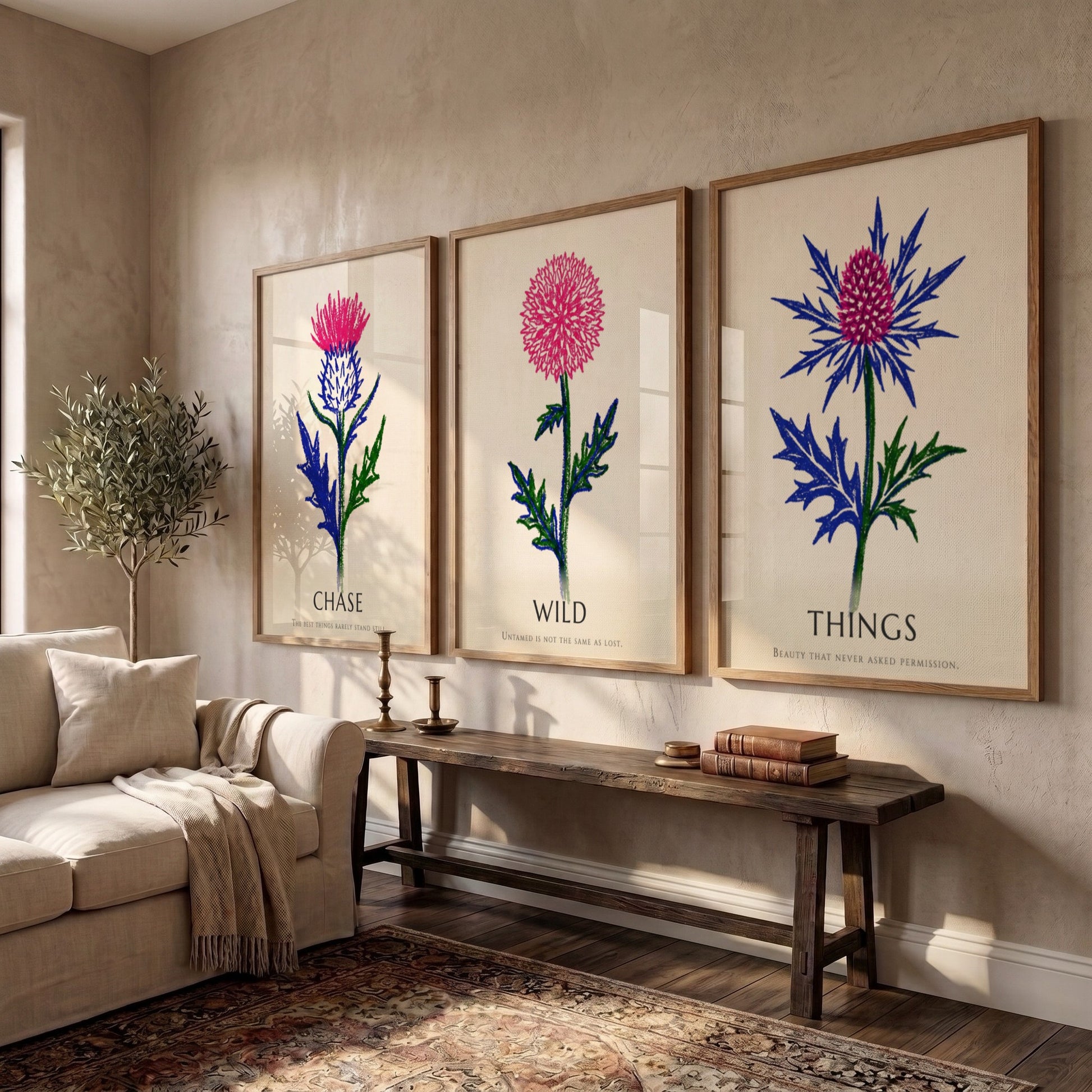Poster set featuring Things Wild Chase text with vibrant pink and blue thistles