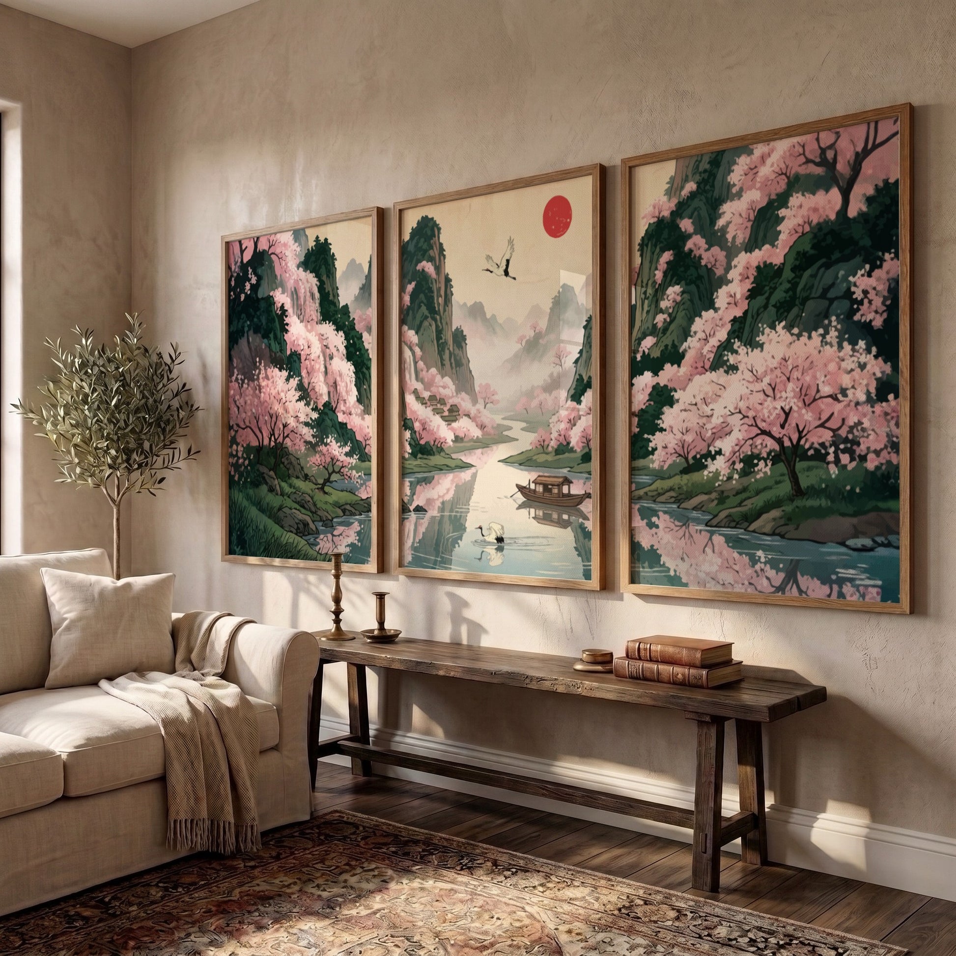 Three framed Japanese landscape panels featuring pink cherry blossoms, a river, and mountains.