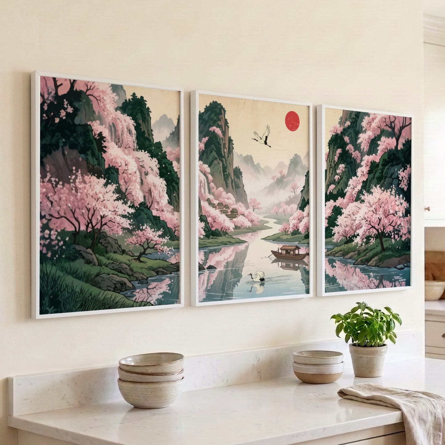 Three framed Japanese landscape panels featuring pink cherry blossoms, a river, and mountains.