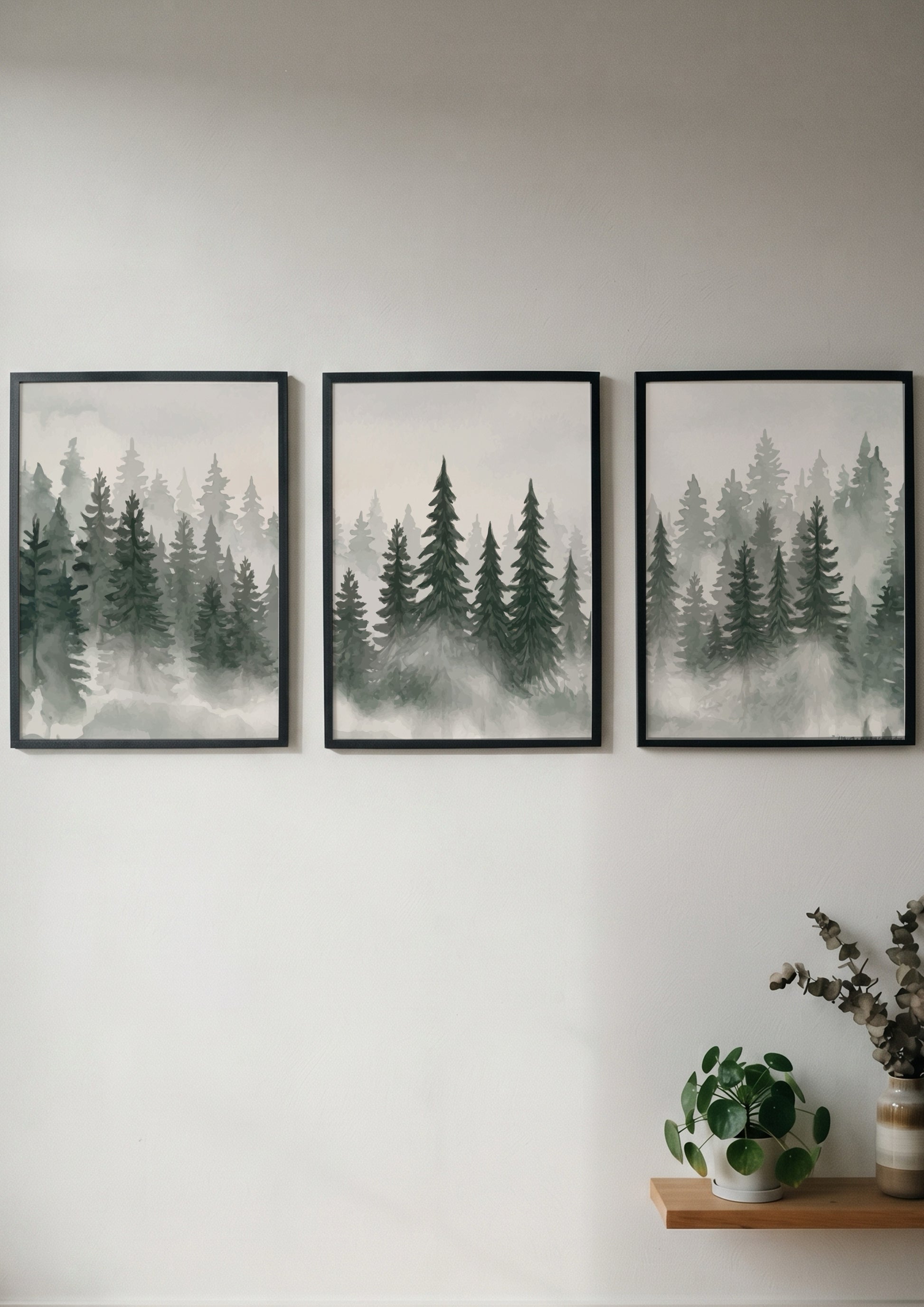 Three framed prints showing a misty pine forest in shades of green and grey
