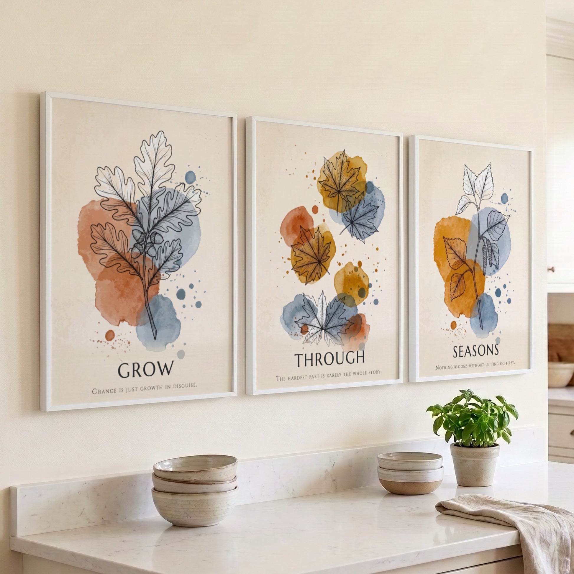 Poster triptych showing watercolour leaves in orange and blue with seasonal text captions