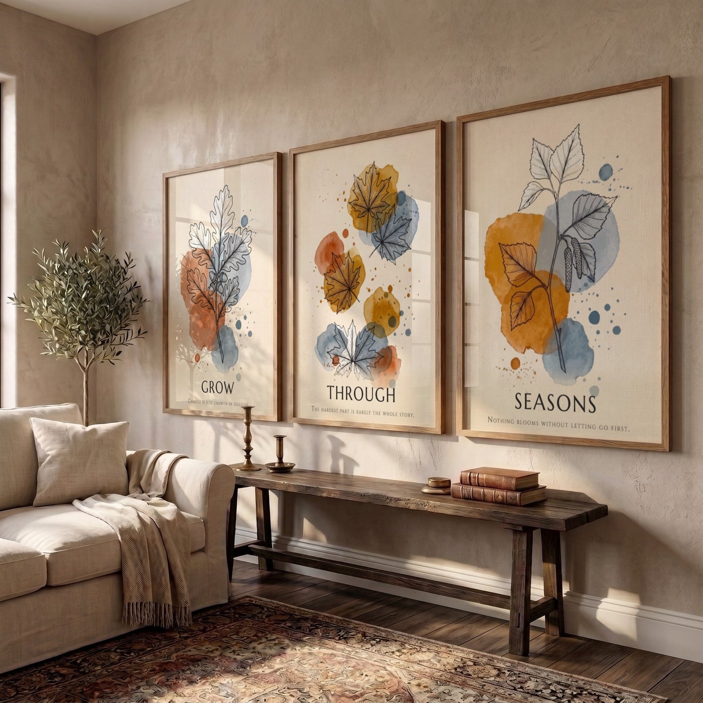 Poster triptych showing watercolour leaves in orange and blue with seasonal text captions