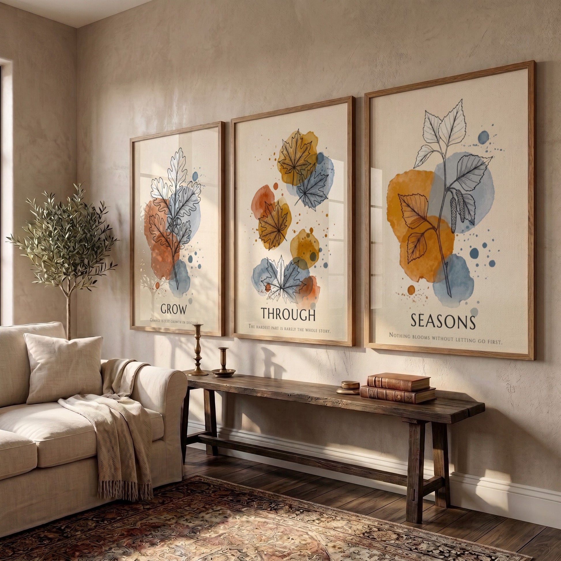 Poster triptych showing watercolour leaves in orange and blue with seasonal text captions