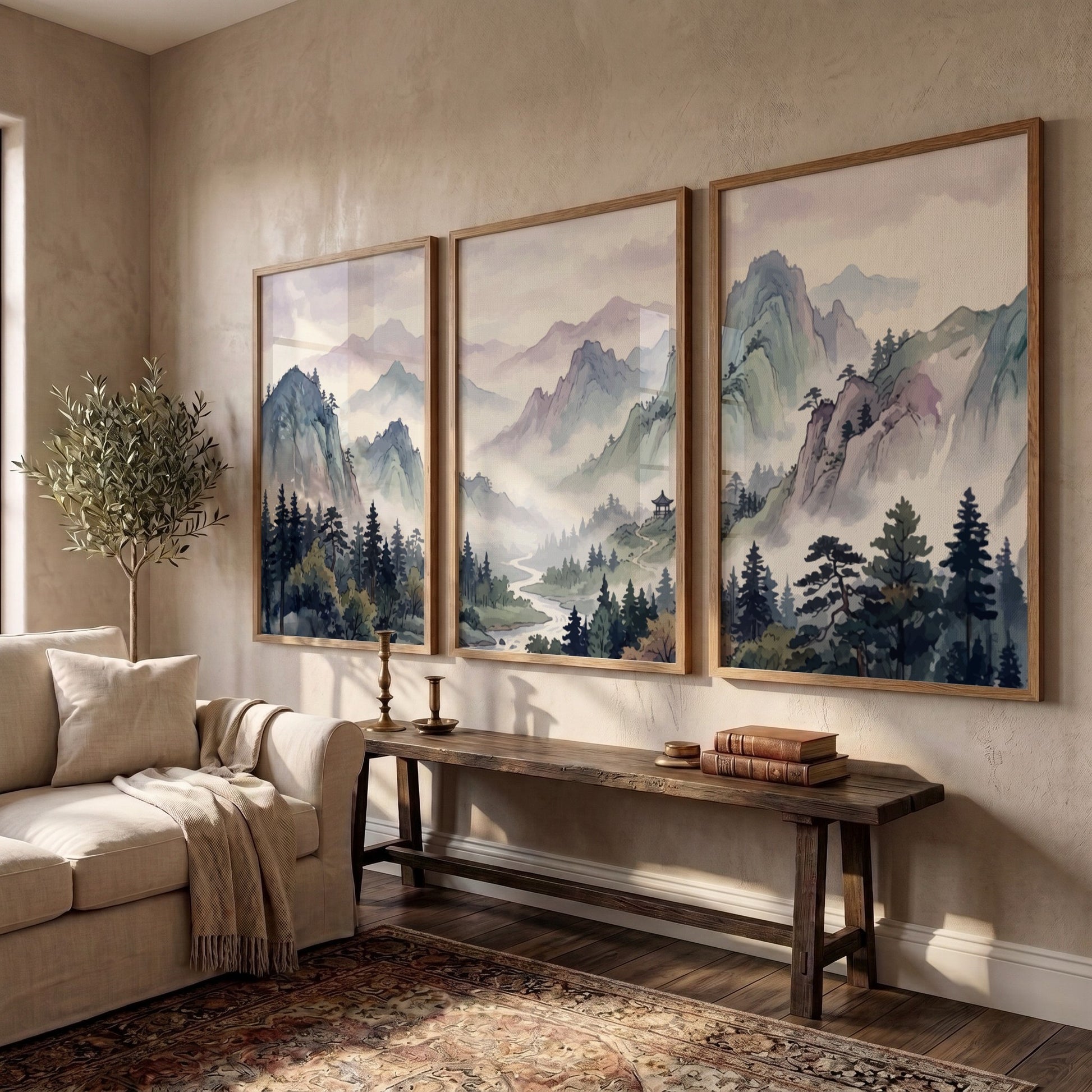 Triptych of Japanese mountain valley landscape prints in soft watercolour blues and lavenders.
