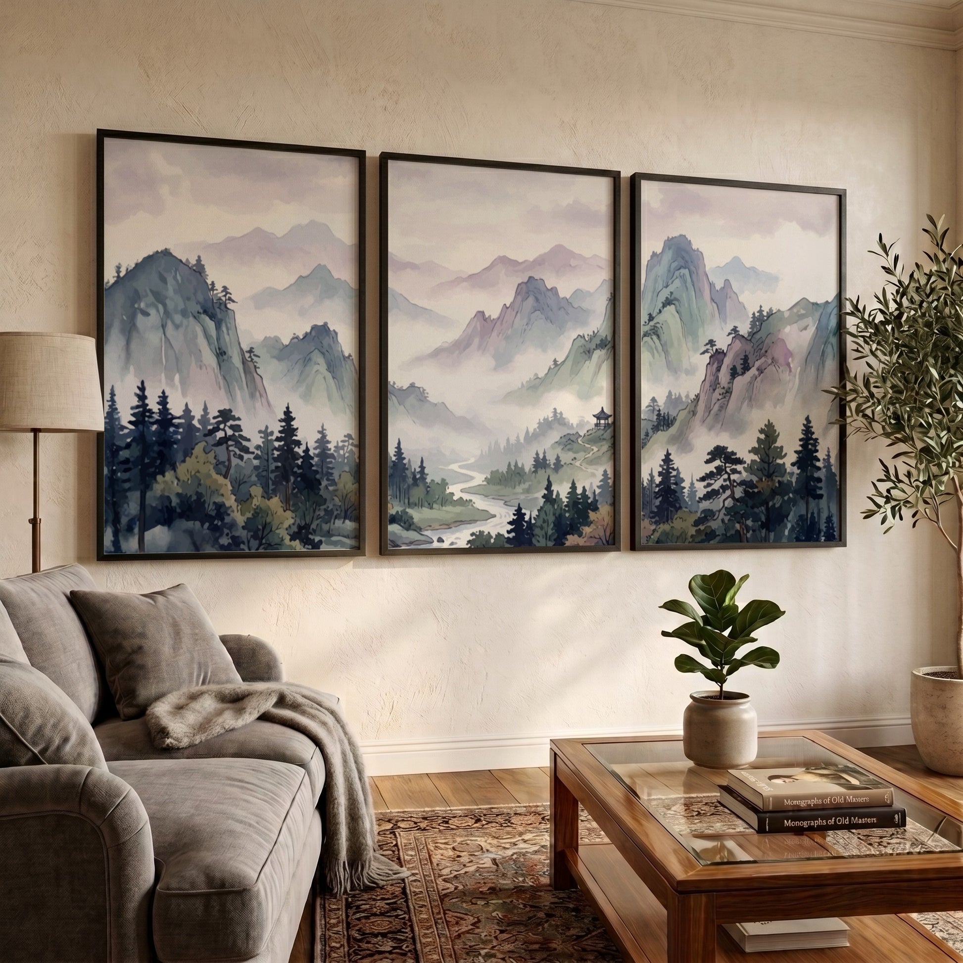 Triptych of Japanese mountain valley landscape prints in soft watercolour blues and lavenders.