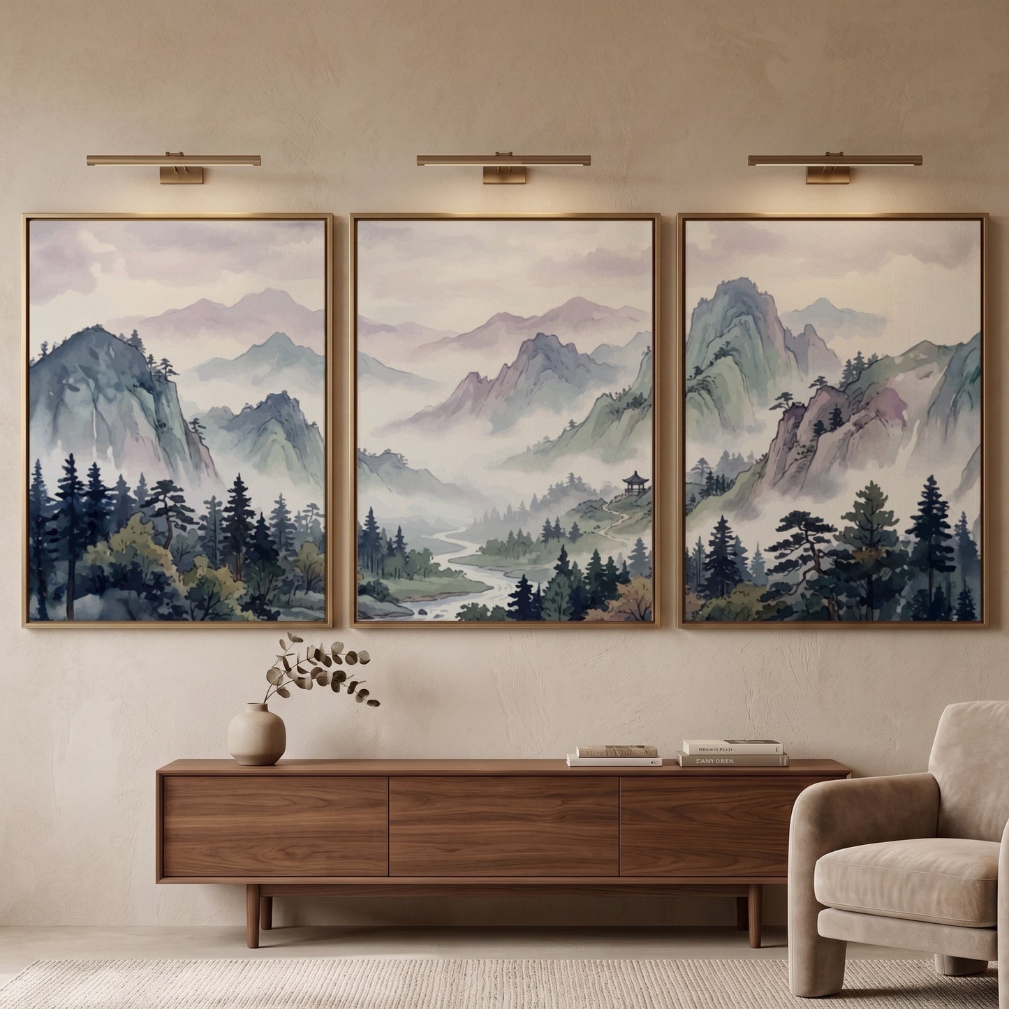 Triptych of Japanese mountain valley landscape prints in soft watercolour blues and lavenders.