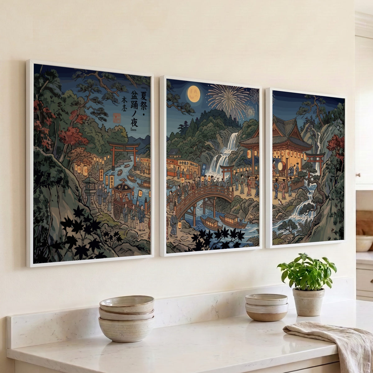 Three framed Japanese Ukiyo-e style posters showing a night festival with lanterns and waterfalls