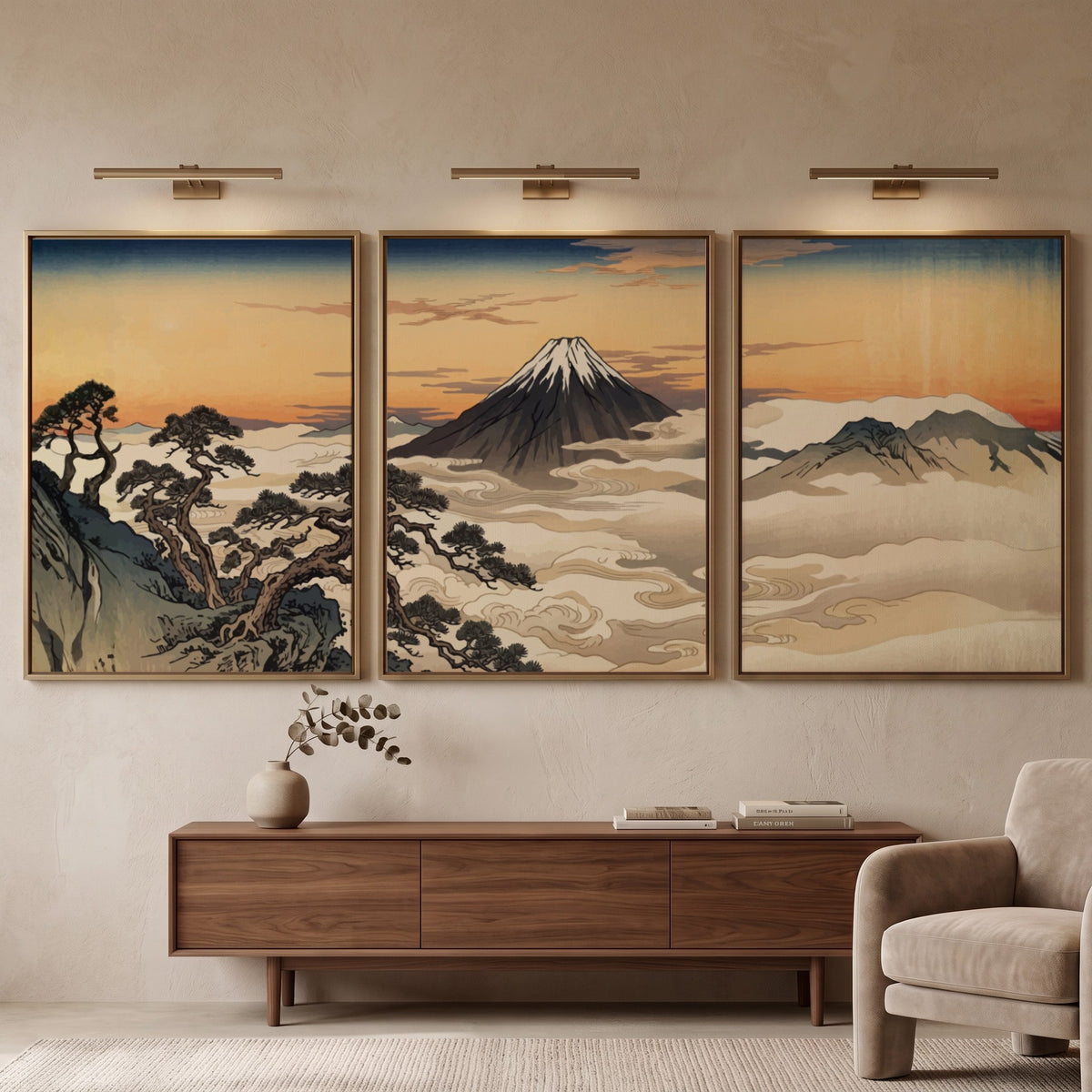 Three framed Japanese landscape prints featuring Mount Fuji rising above clouds at sunset