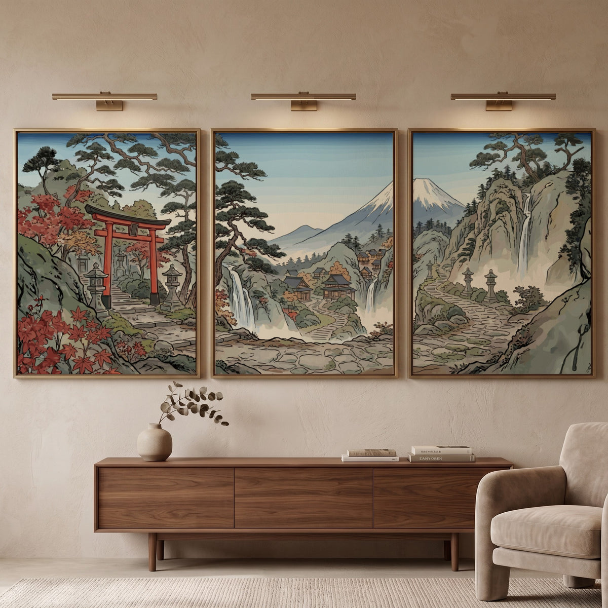 Three framed Japanese woodblock prints displaying a torii gate, waterfalls, and Mount Fuji.
