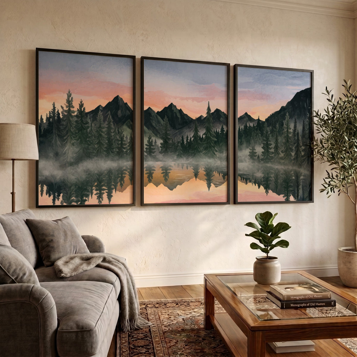 Three framed landscape prints showing misty mountains and pine trees reflected in water