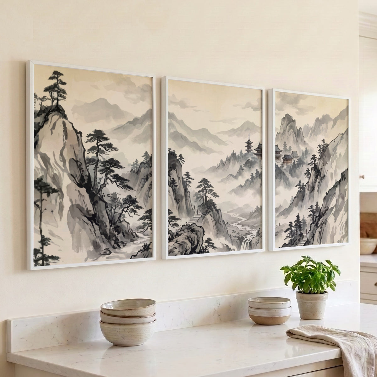 Three framed Japanese ink wash mountain landscapes with pine trees and misty valleys