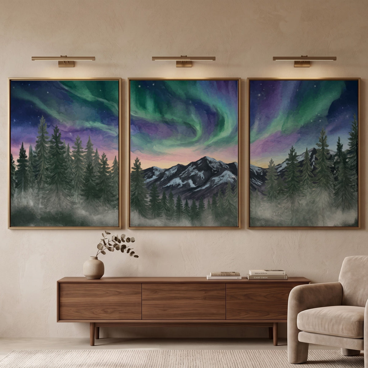 Three framed landscape prints showing green and purple aurora borealis over mountain forests
