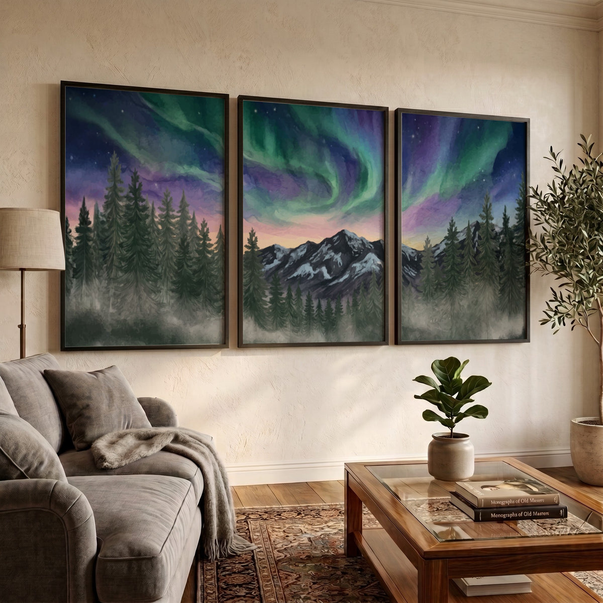 Three framed landscape prints showing green and purple aurora borealis over mountain forests