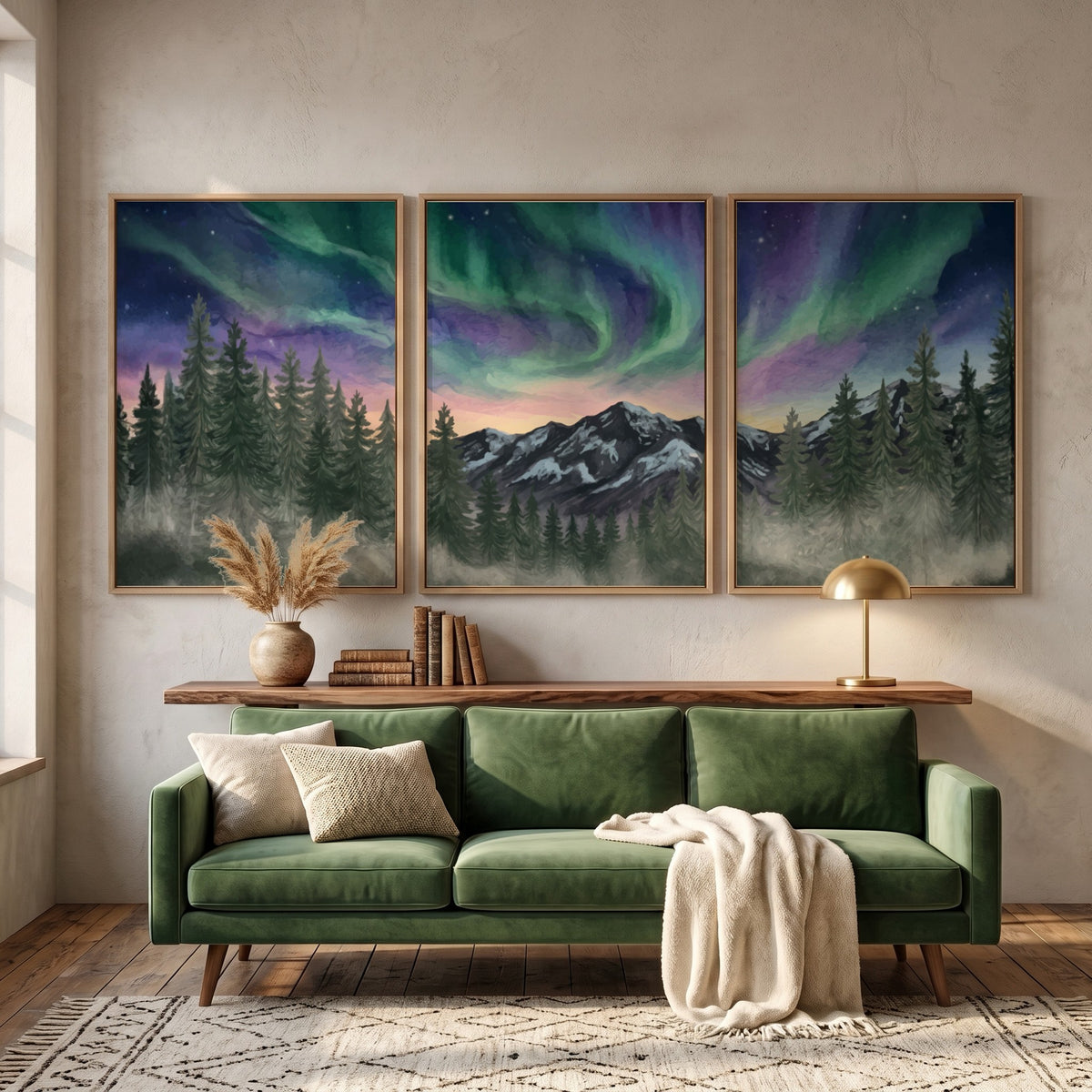 Three framed landscape prints showing green and purple aurora borealis over mountain forests