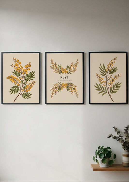 Poster triptych featuring delicate yellow mimosa flowers and the word REST on cream.