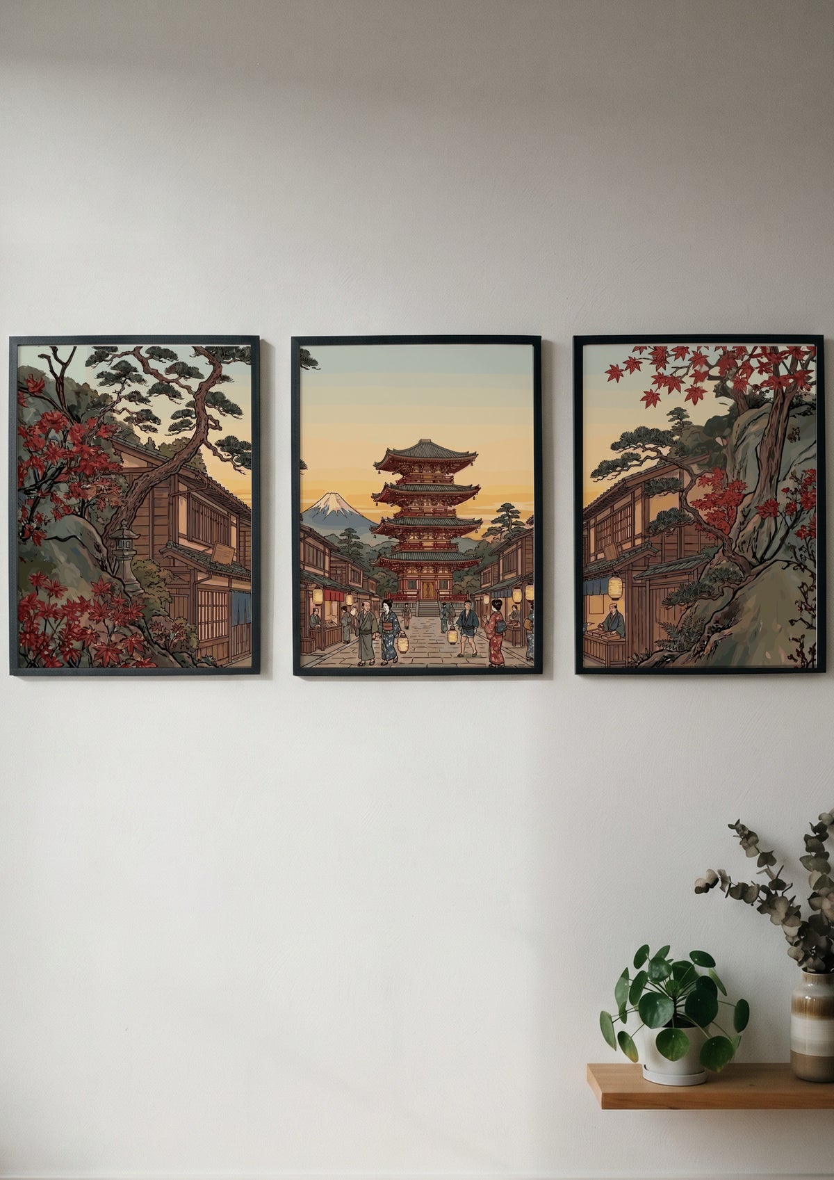 Three vertical framed prints featuring a Japanese pagoda landscape with autumn trees and mountain