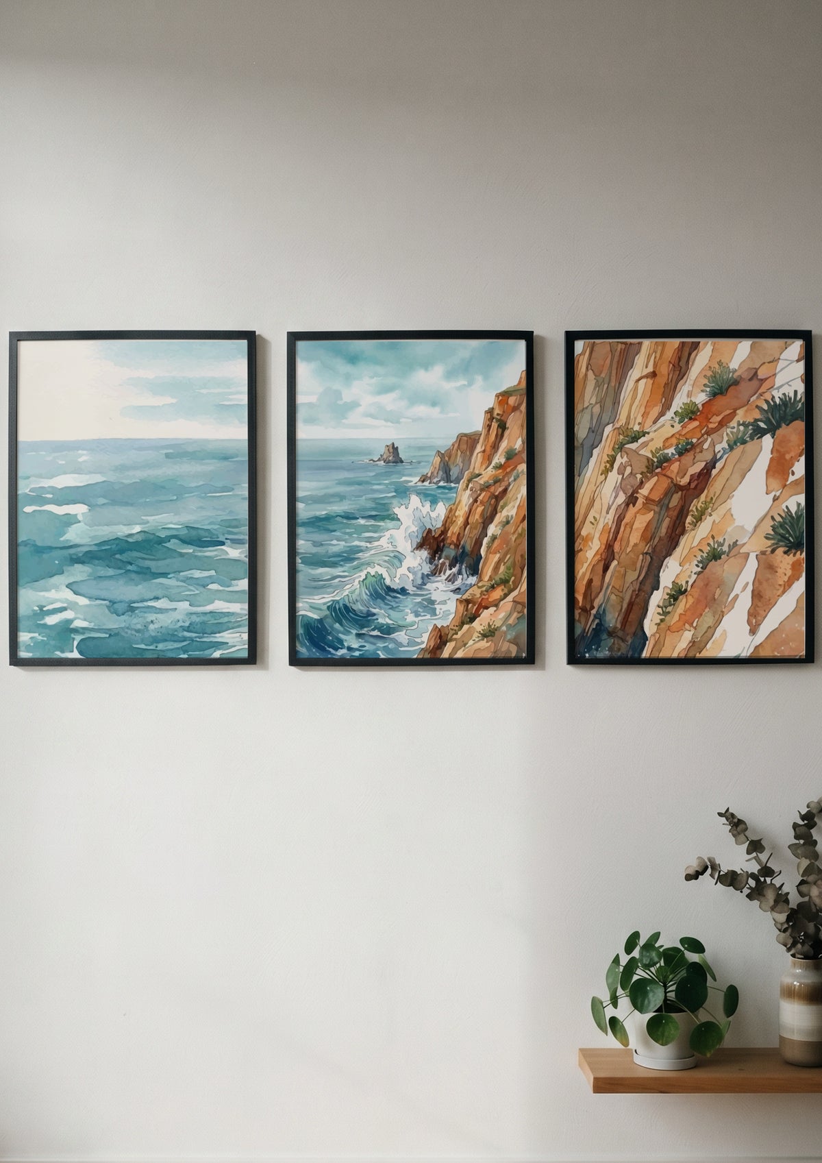 Coastal triptych watercolour print showing ocean waves and rugged cliffs in blue tones