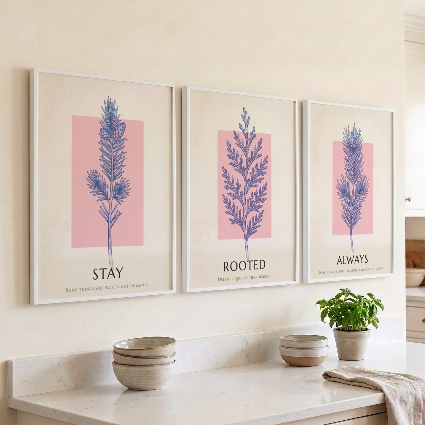 Poster set featuring three botanical prints with navy foliage on cream and blush backgrounds.