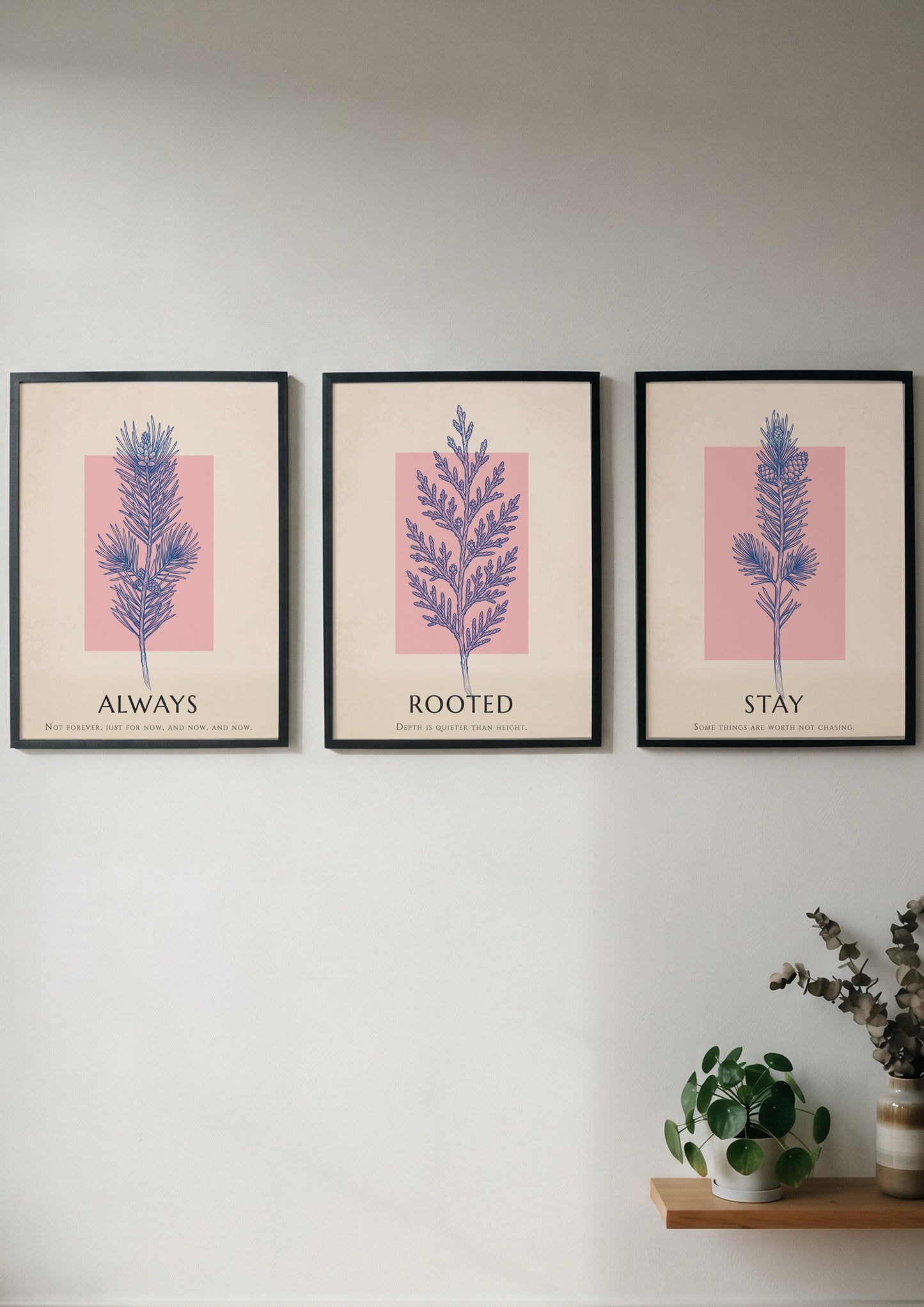 Poster set featuring three botanical prints with navy foliage on cream and blush backgrounds.
