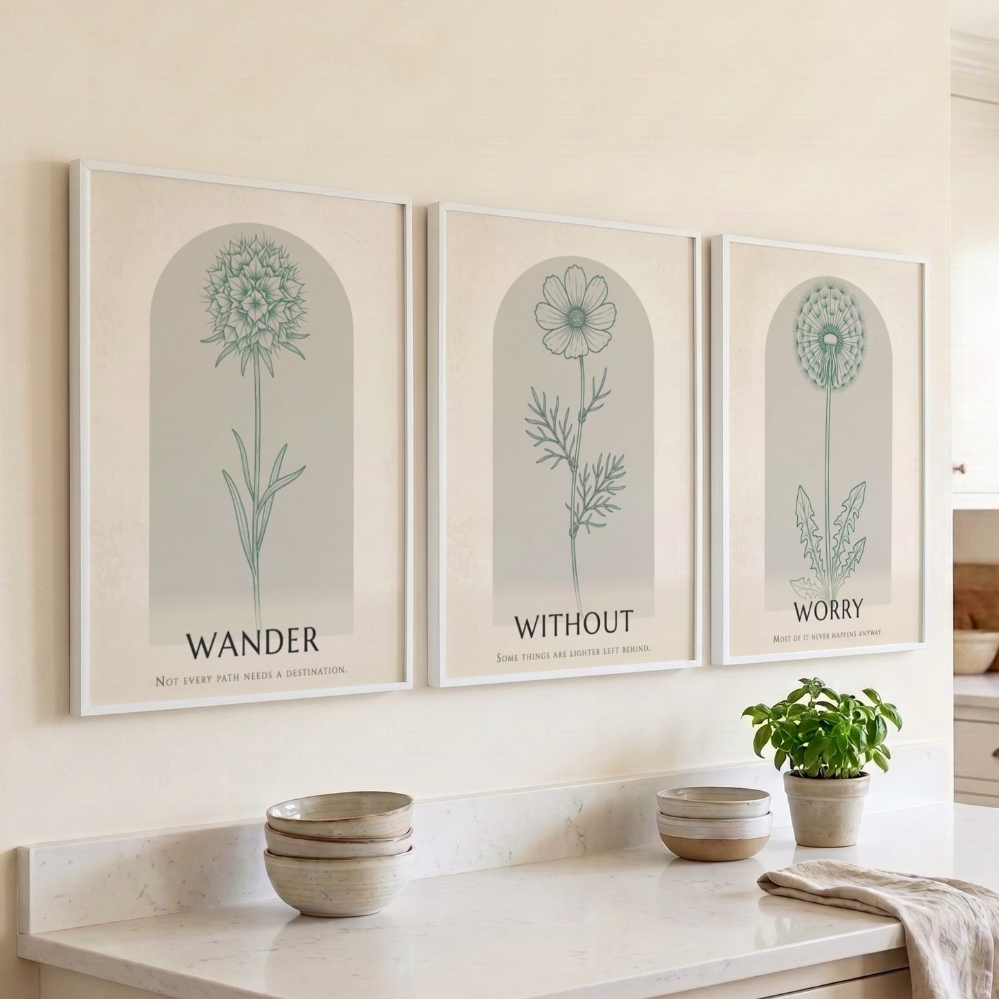 Poster set displaying three sage green wildflower illustrations within arched frames on beige.