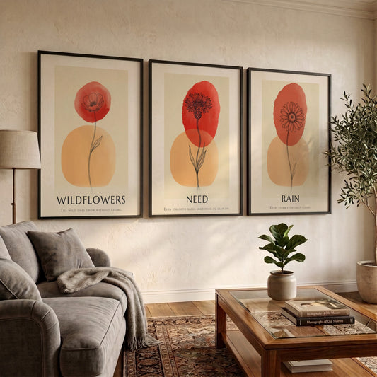 Poster trio featuring Rain Need Wildflowers text with delicate floral ink illustrations and terracotta.